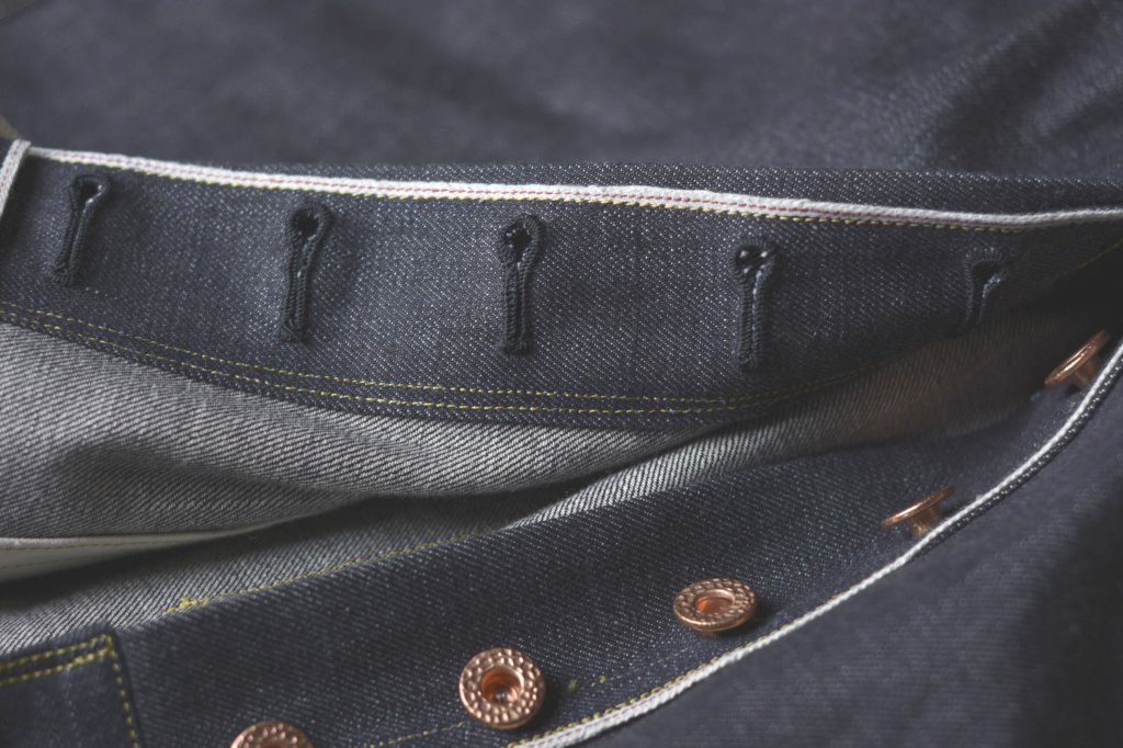 Jeans with one-piece button fly.